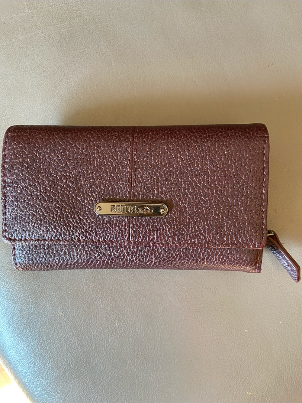 Roots Pebbled Burgundy Leather Wallet with Gold Plaque